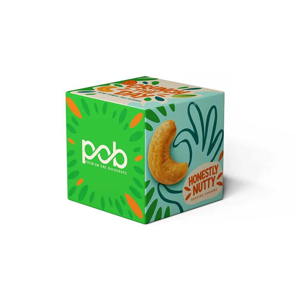 3D fabric cube display featuring colorful cashew graphics and branded side panels