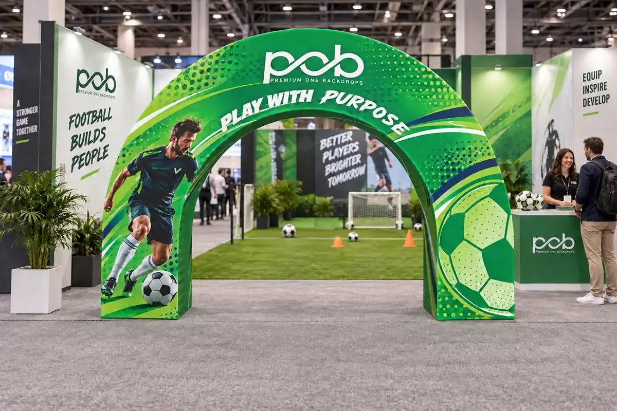 Branded 3D event archway featuring football graphics at the entrance to a sports exhibition booth