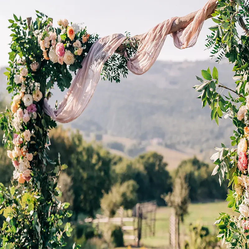 Pillow_Cover_Backdrops_Flower_arch_with_flowers_and_pink_fabric-pob-backdrops