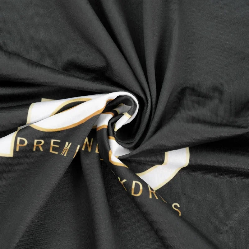 Printed fabric material close-up with vibrant event backdrop graphics