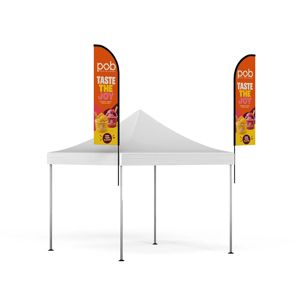 Side angle view of a white event canopy with two vertical feather flags displaying promotional graphics