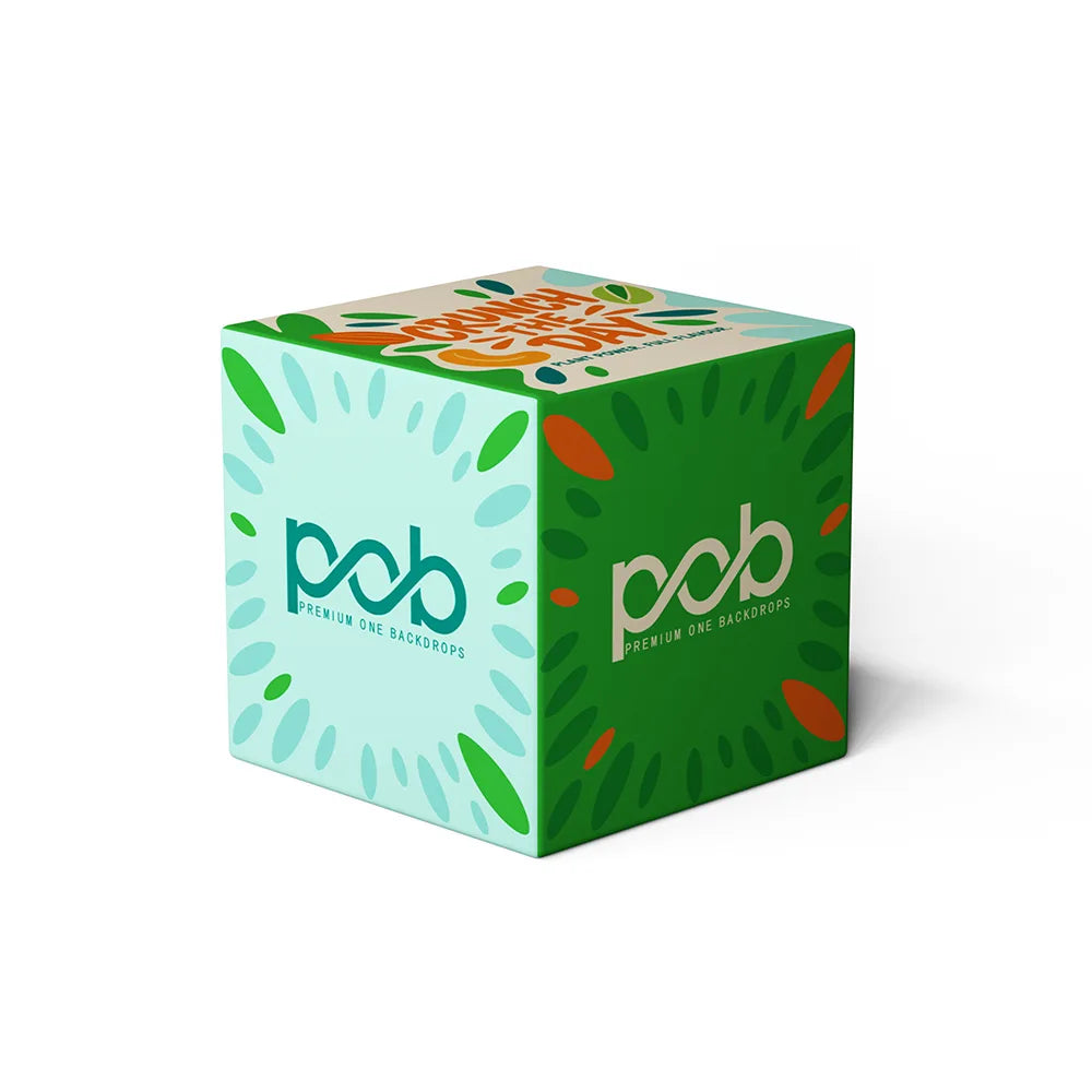 Angled view of a 3D cube display with green branded graphics printed on multiple sides