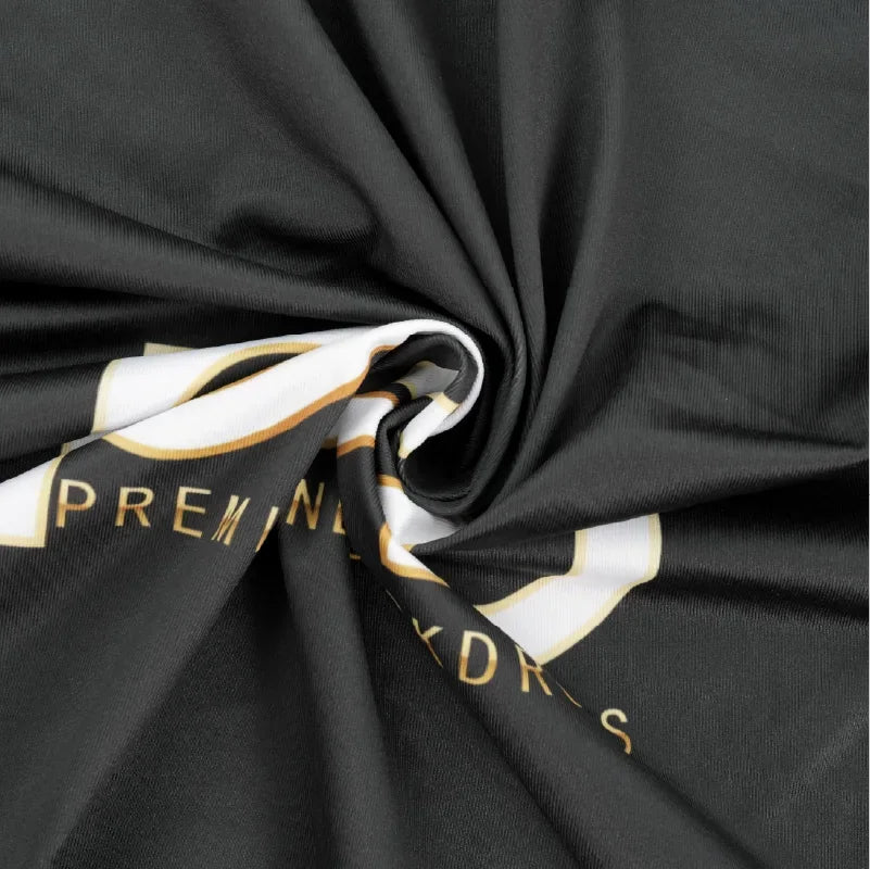 Close-up of custom printed black fabric showing the texture and flexibility of the counter graphic