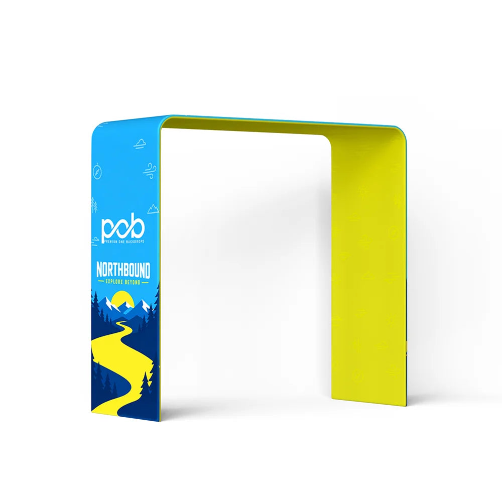 Three-quarter view of a square arch display featuring blue mountain graphics and yellow interior panels